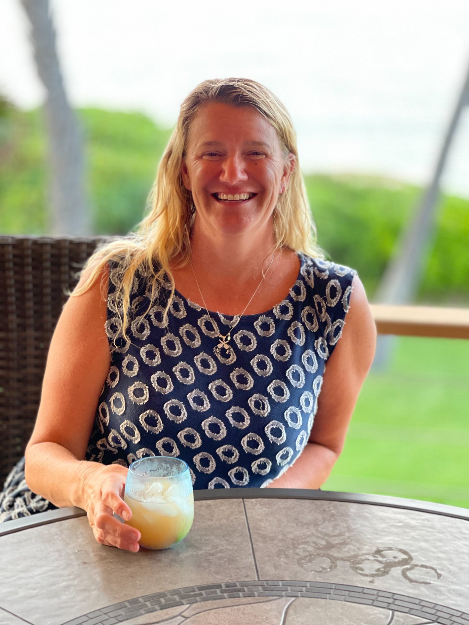 Jill at oceanfront table in Hawaii
