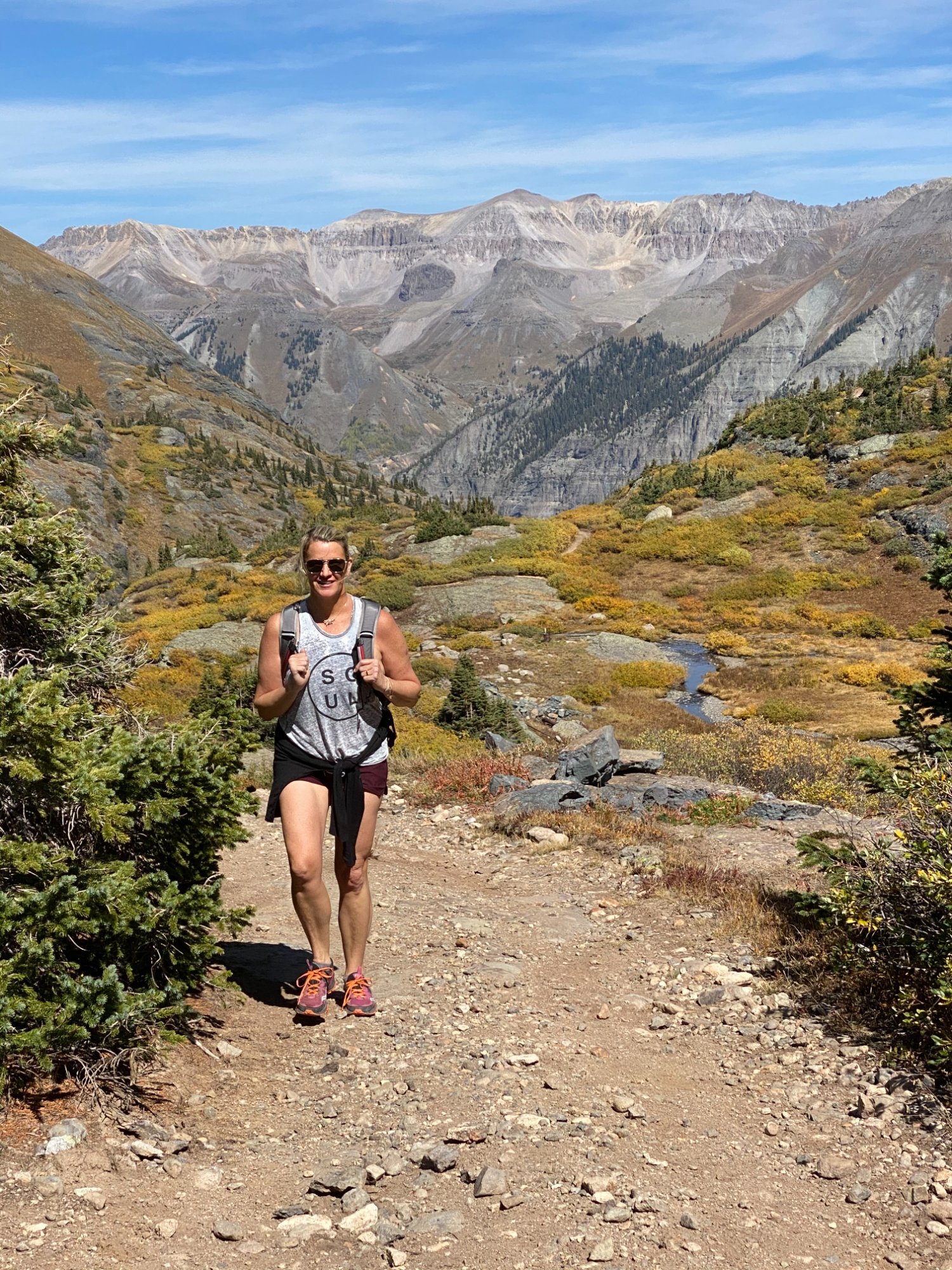 Jill hiking in Telluride mountains, fall foliage